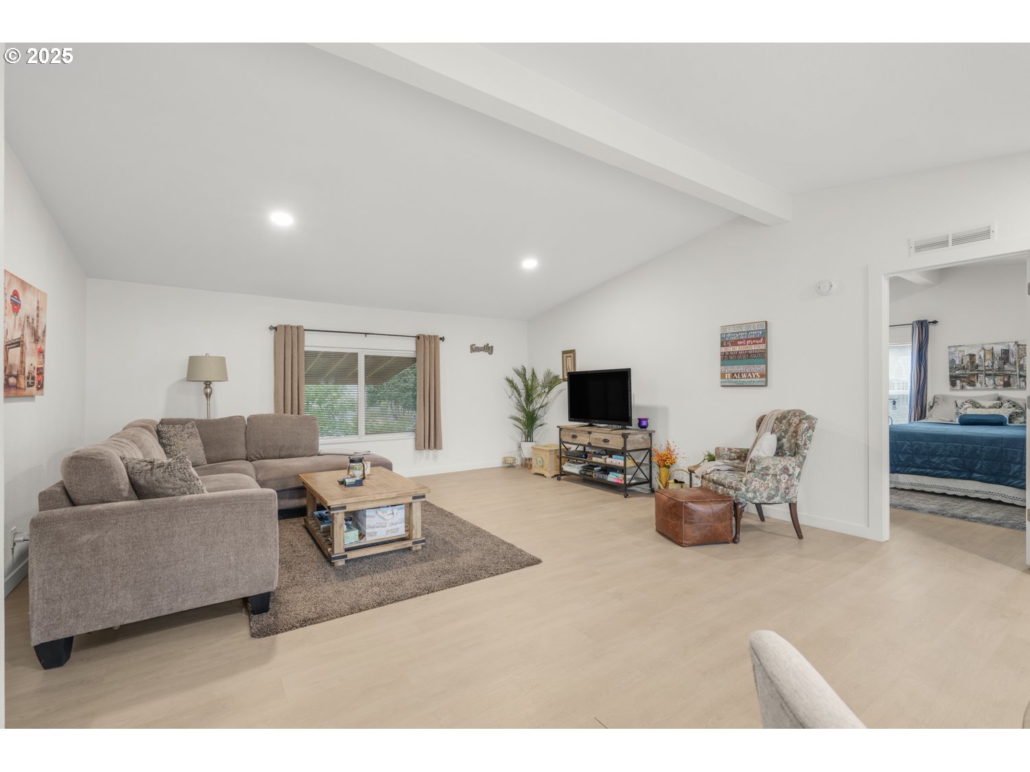 18780 South Central Point Road, Unit 19 Oregon City, OR 97045 - Photo 5 of 25 a living room with furniture and a flat screen tv