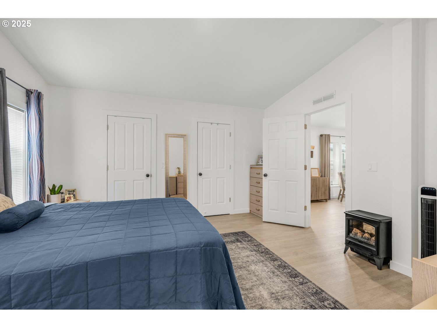 18780 South Central Point Road, Unit 19 Oregon City, OR 97045 - Photo 9 of 25 a bedroom with a bed and a view of kitchen