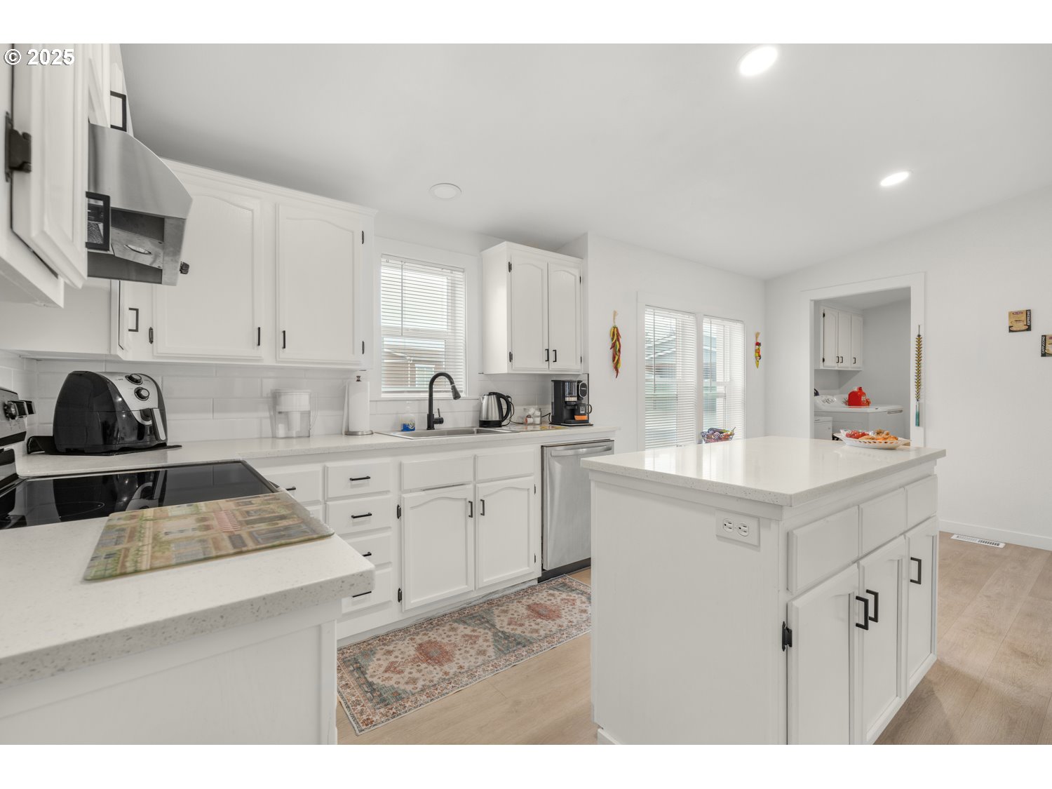 18780 South Central Point Road, Unit 19 Oregon City, OR 97045 - Photo 10 of 25 a kitchen with cabinets a sink a window and stainless steel appliances