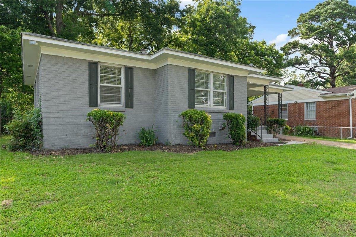 2717 Merle Street Memphis, TN 38118 - Photo 14 of 18 Gray brick exterior featuring white trim and dark window shutters