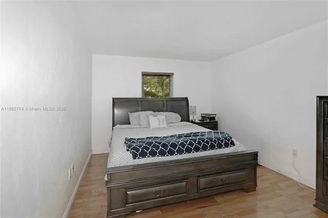 a view of a white house with a swimming pool