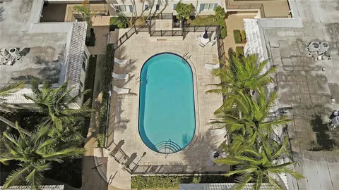 a view of a fireplace with potted plants