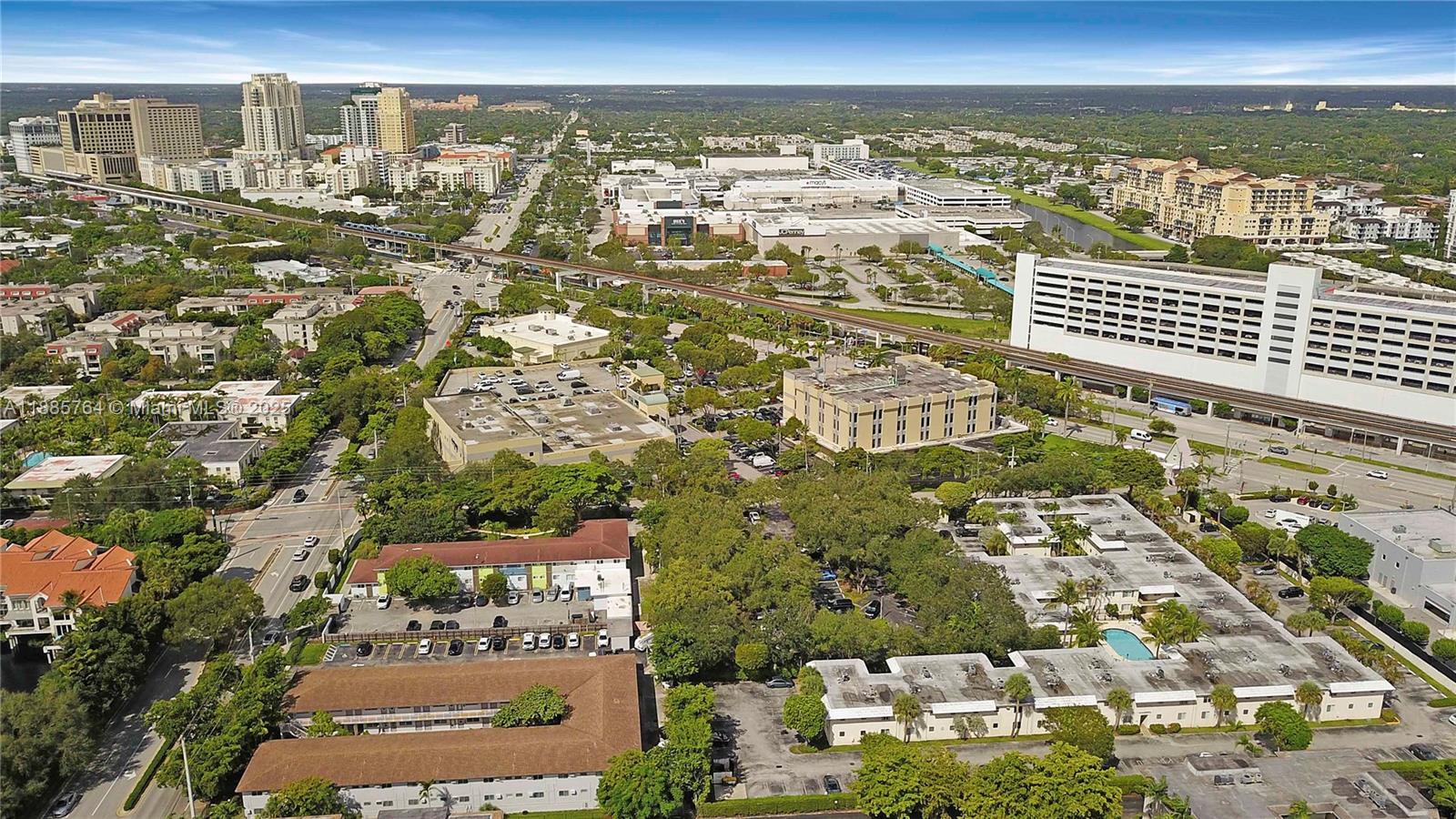 8617 Southwest 68th Court, Unit 24 Pinecrest, FL 33156 - Photo 5 of 24 an aerial view of residential building and parking space