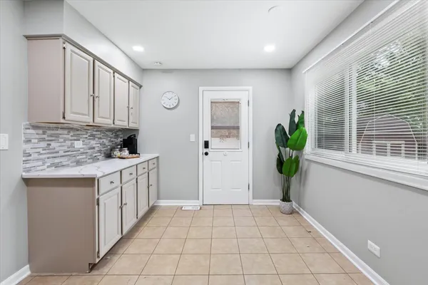 a view of a kitchen with cabinets