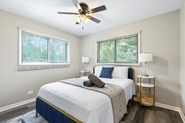 a bedroom with a large bed and a window