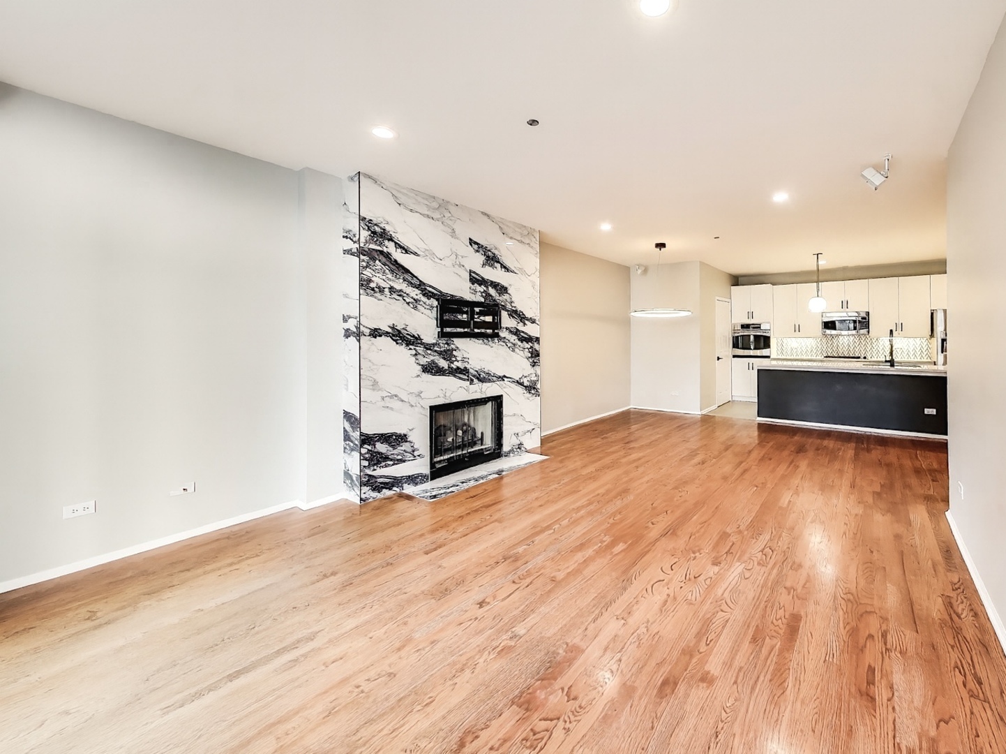 33 West Huron Street, Unit 412 Chicago, IL 60654 - Photo 11 of 33 a view of a kitchen with a sink and a stove top oven
