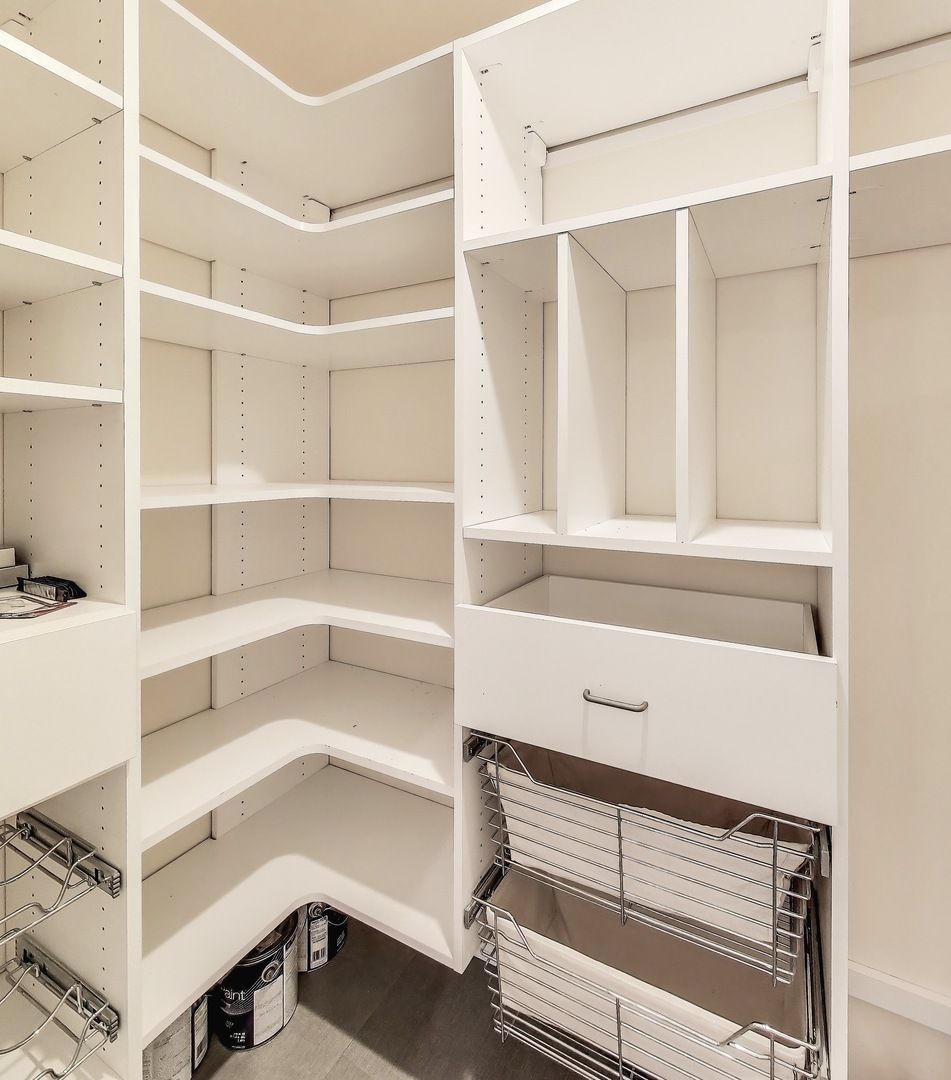 33 West Huron Street, Unit 412 Chicago, IL 60654 - Photo 18 of 33 a view of walk in closet with empty racks