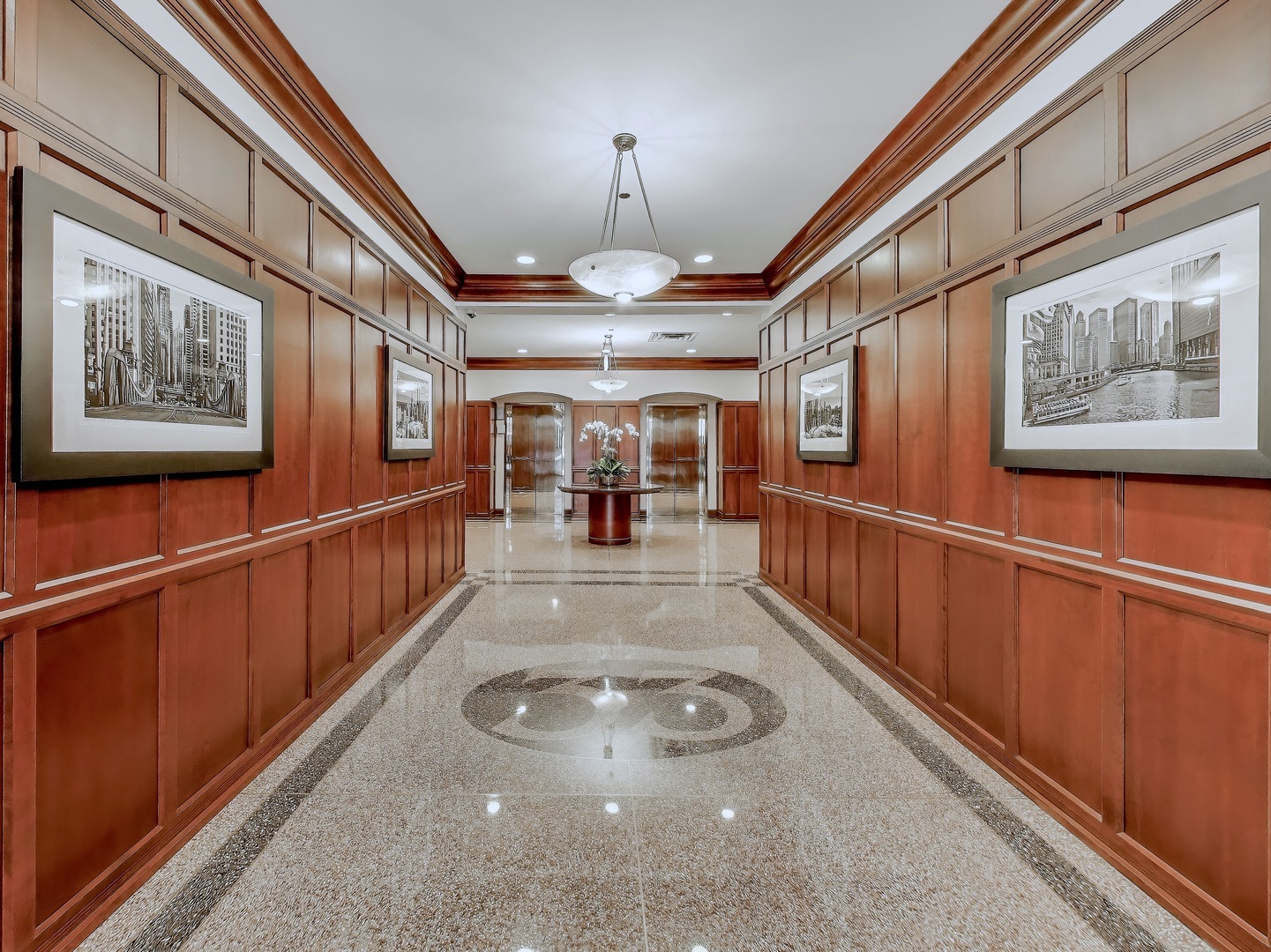 33 West Huron Street, Unit 412 Chicago, IL 60654 - Photo 2 of 33 a view of a hallway with wooden floor and staircase