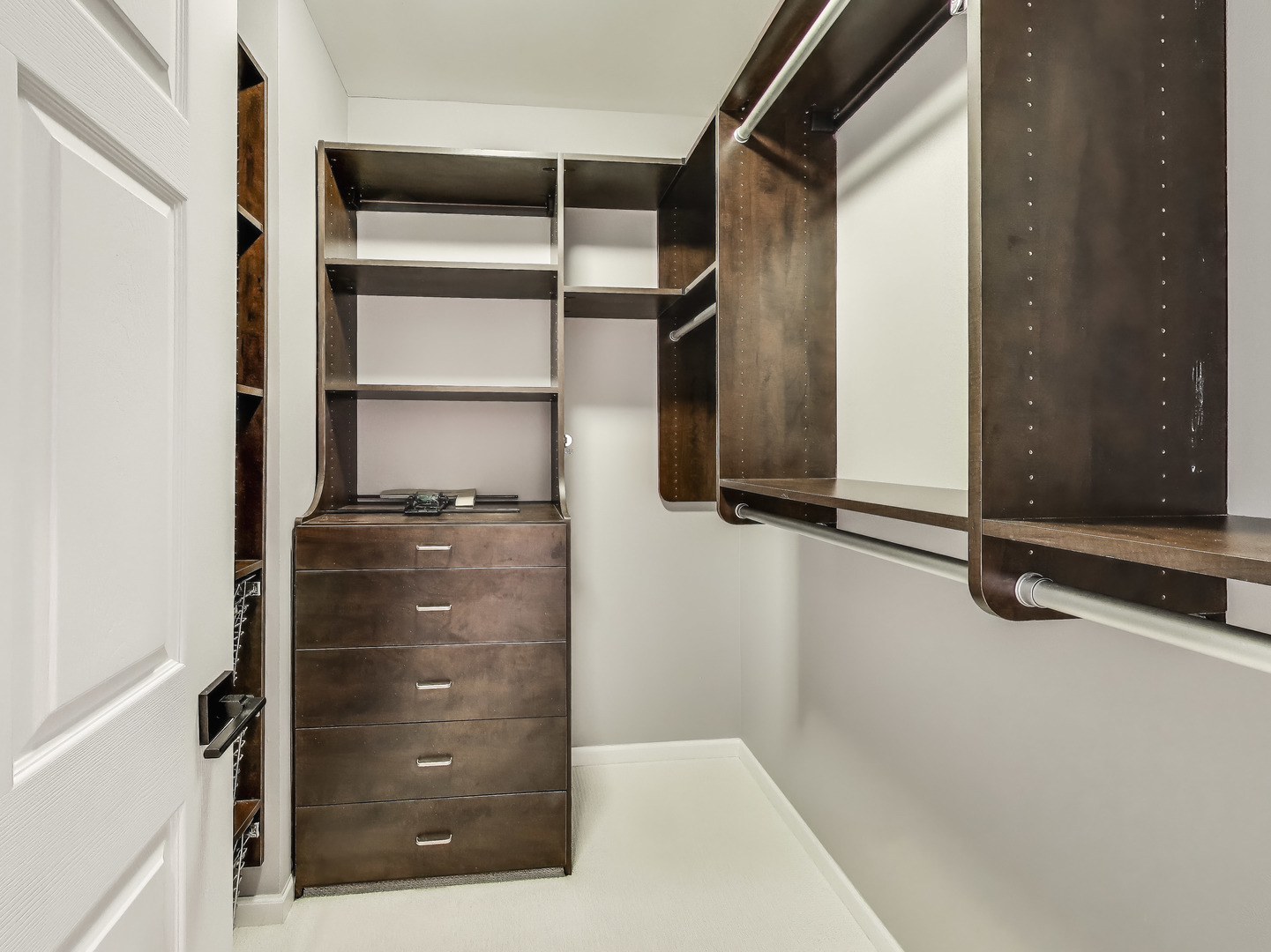 33 West Huron Street, Unit 412 Chicago, IL 60654 - Photo 23 of 33 a view of walk in closet with empty racks