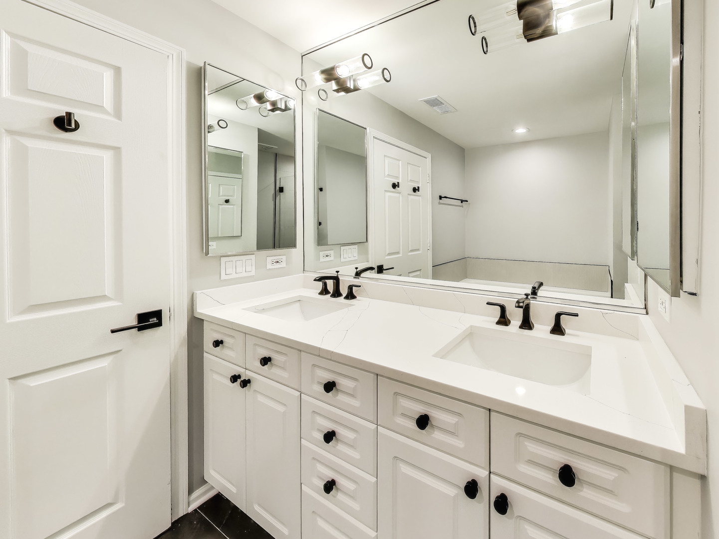 33 West Huron Street, Unit 412 Chicago, IL 60654 - Photo 24 of 33 a bathroom with a sink vanity and mirror