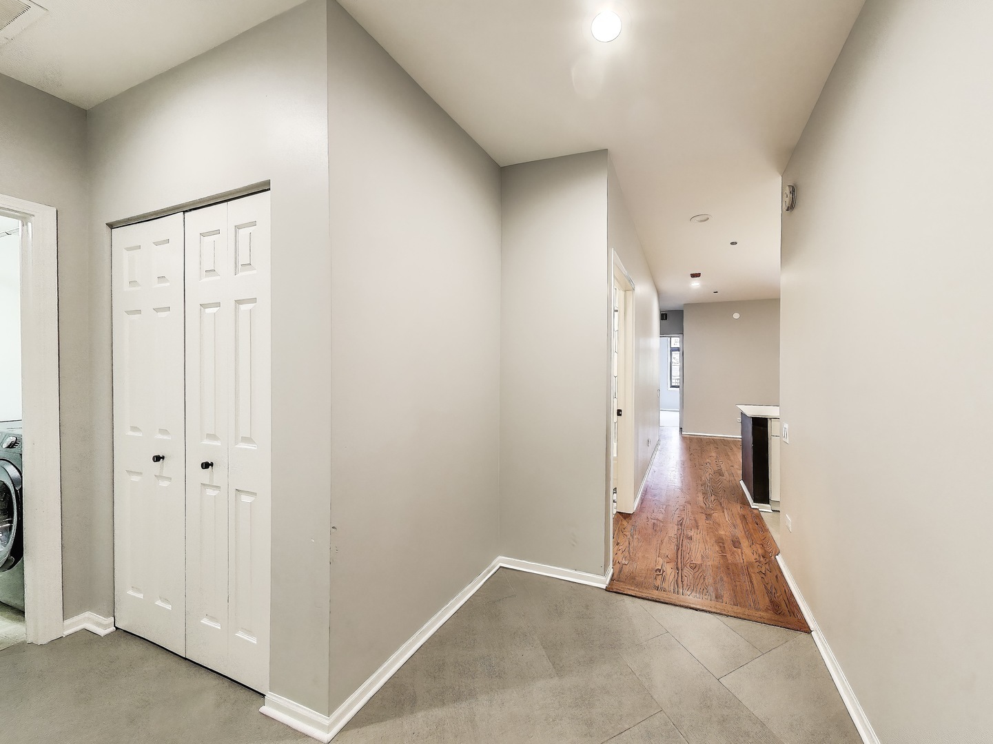 33 West Huron Street, Unit 412 Chicago, IL 60654 - Photo 4 of 33 a view of a hallway with wooden shelves