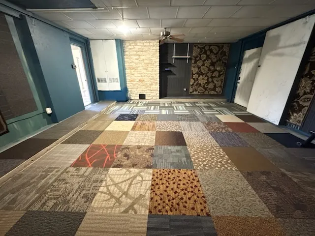 a bathroom with a shower and a toilet