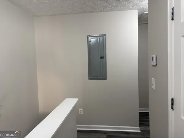 a view of a hallway with stairs