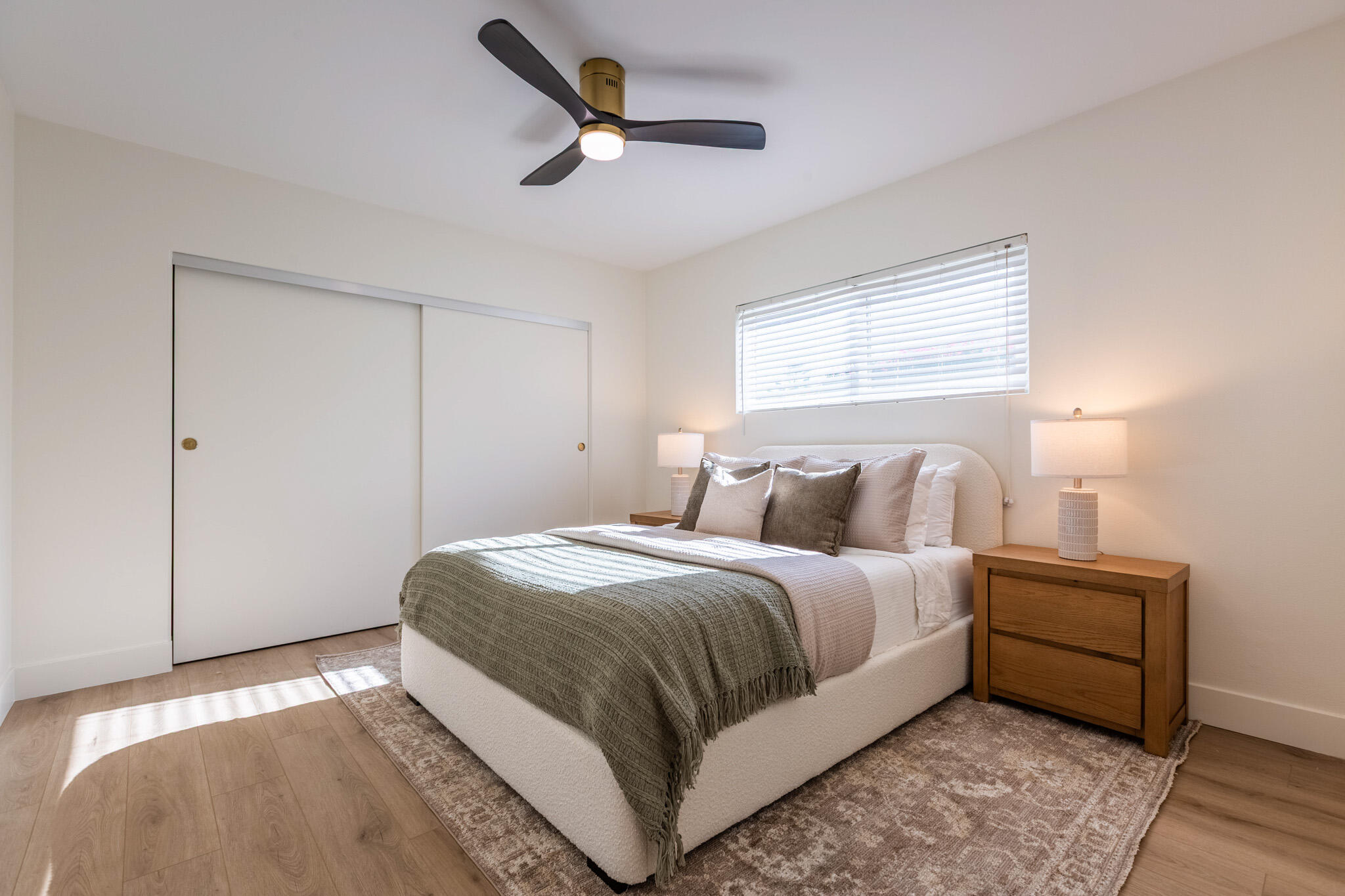 41615 Morningside Court, Unit A Rancho Mirage, CA 92270 - Photo 13 of 20 a bedroom with a bed and a ceiling fan