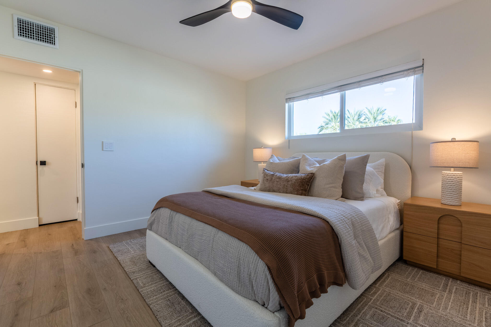 41615 Morningside Court, Unit A Rancho Mirage, CA 92270 - Photo 16 of 20 a bedroom with a bed and a window