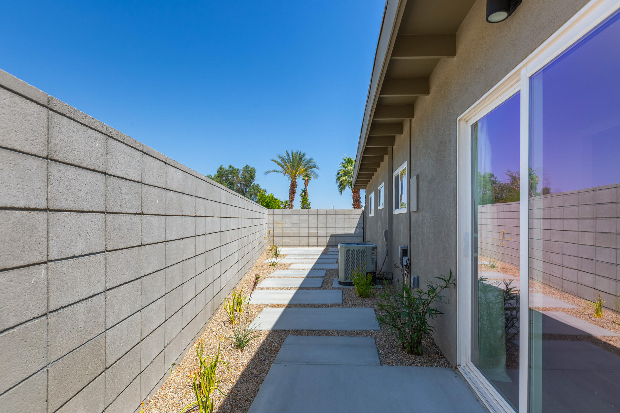 41615 Morningside Court, Unit A Rancho Mirage, CA 92270 - Photo 18 of 20 a path view of a house with a palm tree