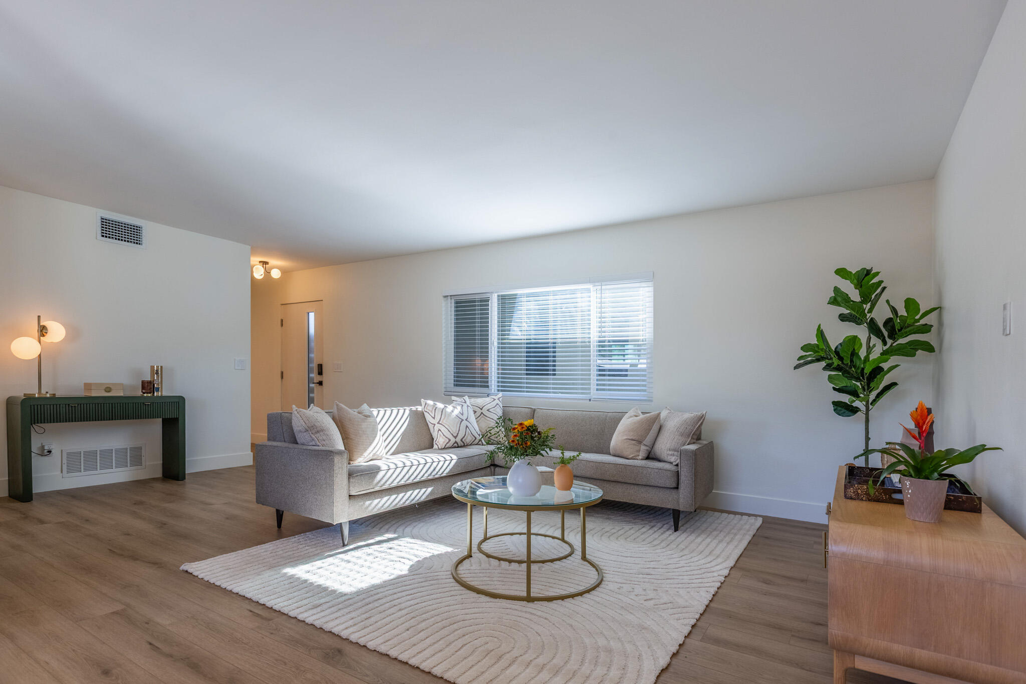 41615 Morningside Court, Unit A Rancho Mirage, CA 92270 - Photo 7 of 20 a living room with furniture or couch and a potted plant