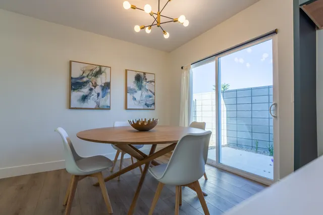 a view of a dining room with furniture window and wooden floor