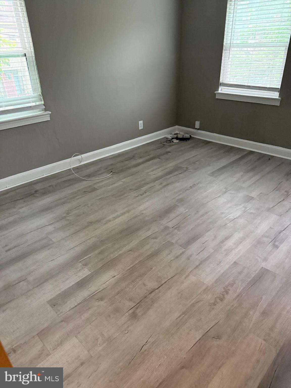 110 P Street Southwest, Unit 2 Washington, DC 20024 - Photo 3 of 7 an empty room with wooden floor and windows