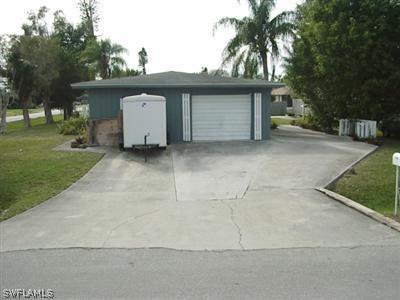 18612 Geranium Road Fort Myers, FL 33967 - Photo 2 of 9 front view of a house with a garage