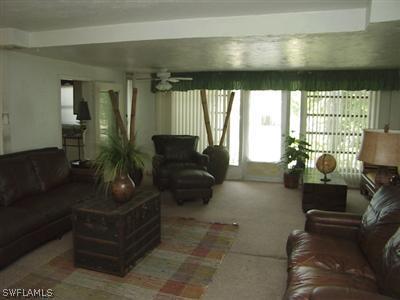 18612 Geranium Road Fort Myers, FL 33967 - Photo 5 of 9 a living room with furniture and a potted plant