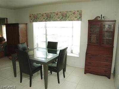18612 Geranium Road Fort Myers, FL 33967 - Photo 6 of 9 a view of a dining room with furniture and window