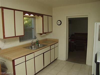 18612 Geranium Road Fort Myers, FL 33967 - Photo 7 of 9 a bathroom with a sink and a mirror