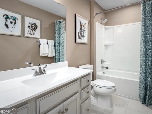 a bathroom with a sink a toilet and a bathtub