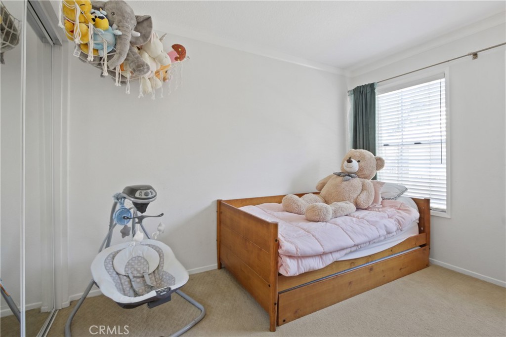 112 Timbre Rancho Santa Margarita, CA 92688 - Photo 5 of 11 a bedroom with a bed and window