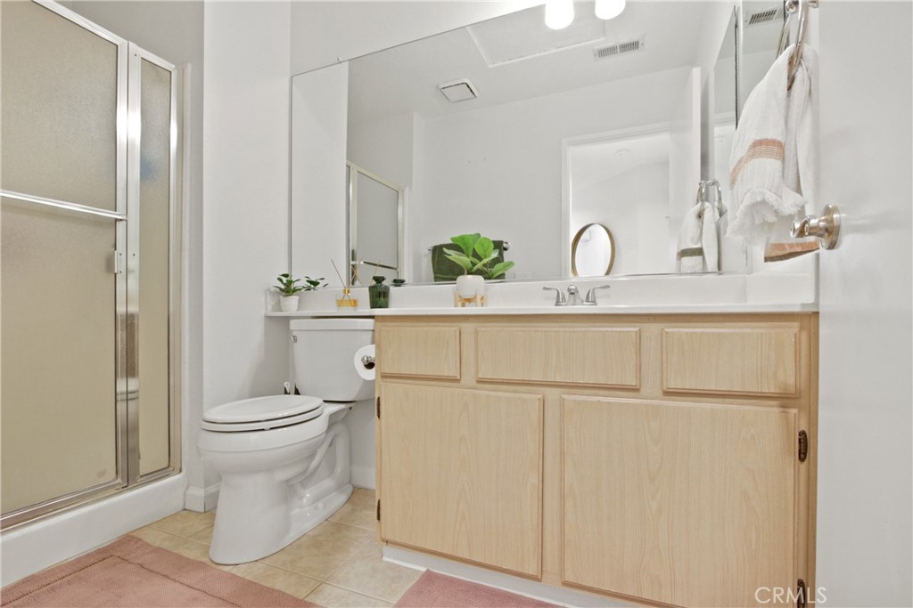 112 Timbre Rancho Santa Margarita, CA 92688 - Photo 6 of 11 a bathroom with a sink a toilet and shower