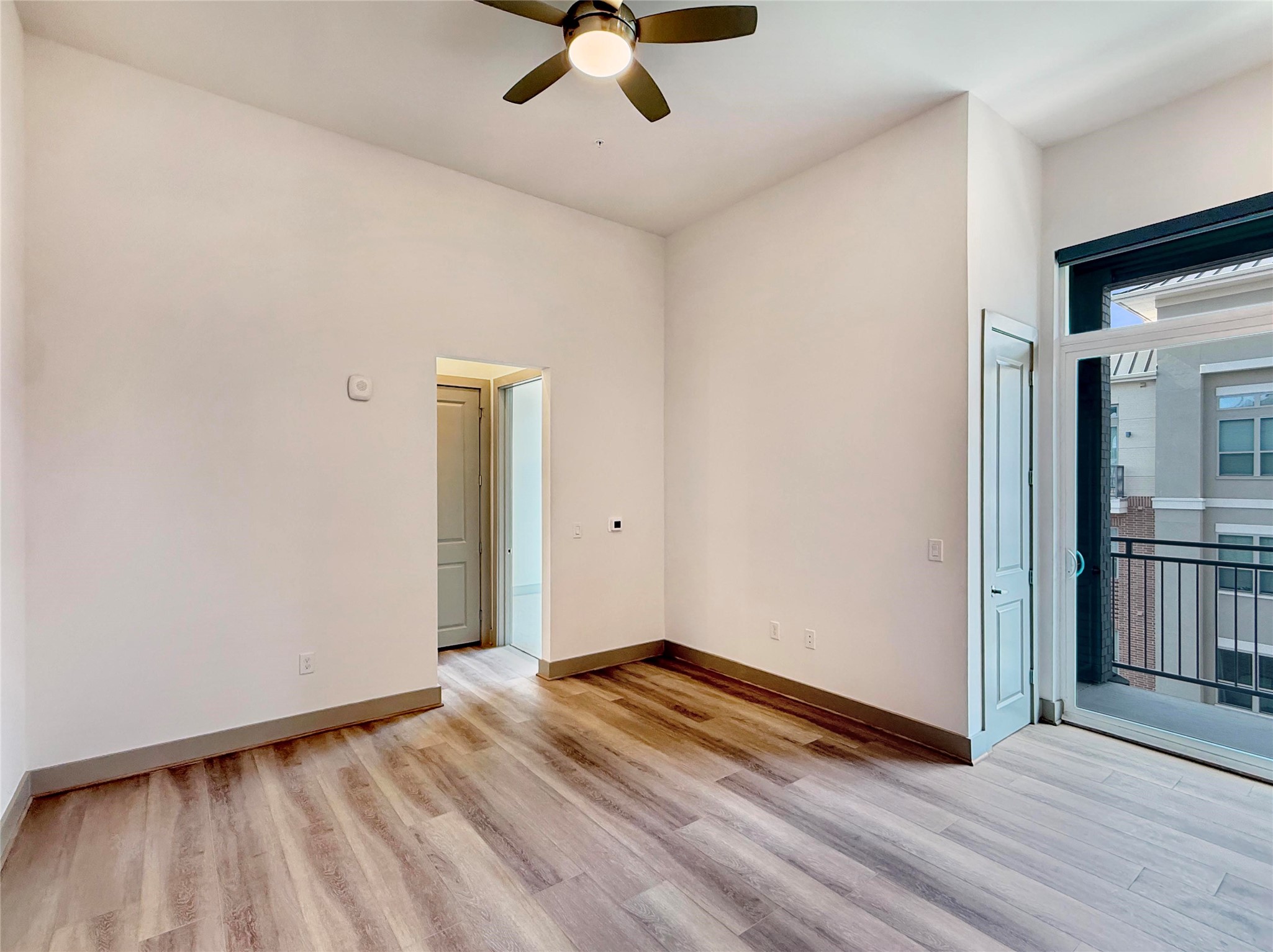170 Malone Street, Unit 3206 Houston, TX 77007 - Photo 2 of 27 wooden floor in an empty room with a window