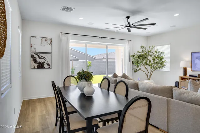 a view of a dining room with furniture window and outside view