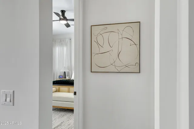 a view of a hallway with wooden floor and a closet