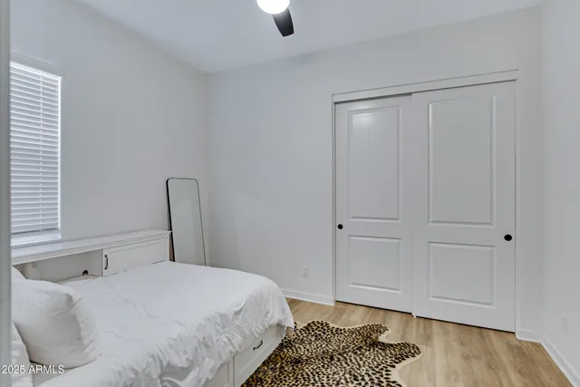 a bedroom with a bed and a dresser