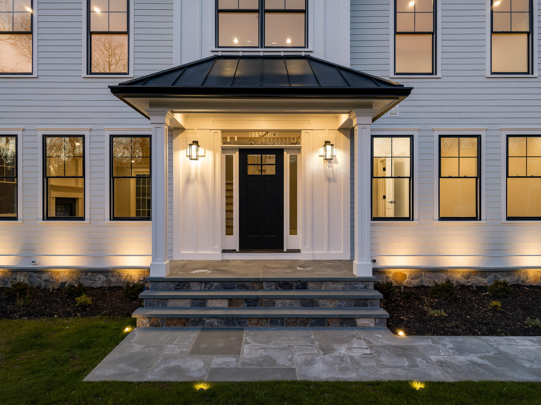 82 Eden Road Stamford, CT 06907 - Photo 2 of 18 a front view of a house with a yard