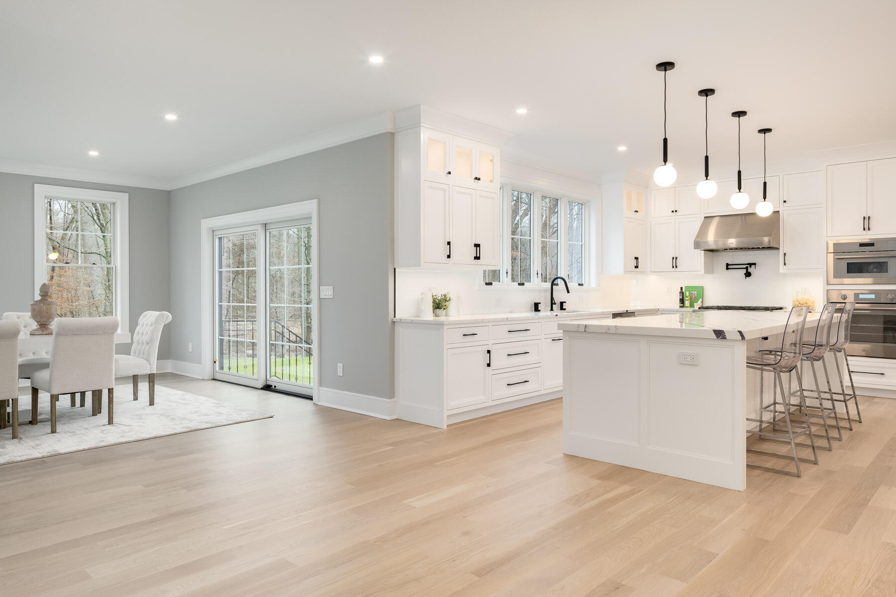 82 Eden Road Stamford, CT 06907 - Photo 10 of 18 a large white kitchen with lots of counter space a sink and appliances