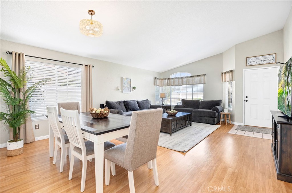 3147 Wimbledon Way Hemet, CA 92545 - Photo 11 of 41 a living room with furniture a wooden floor and a large window