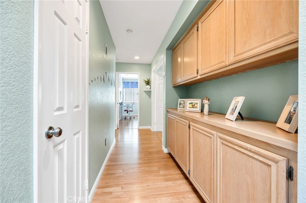 3147 Wimbledon Way Hemet, CA 92545 - Photo 24 of 41 a hallway with washer and dryer