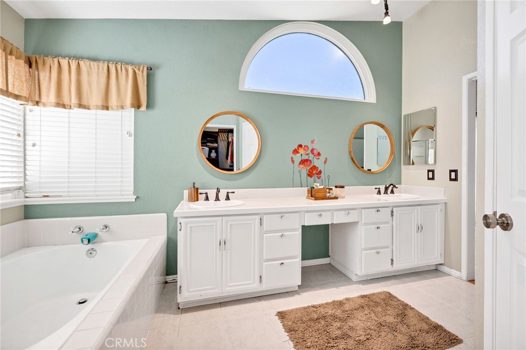 3147 Wimbledon Way Hemet, CA 92545 - Photo 34 of 41 a spacious bathroom with a sink double vanity and a mirror