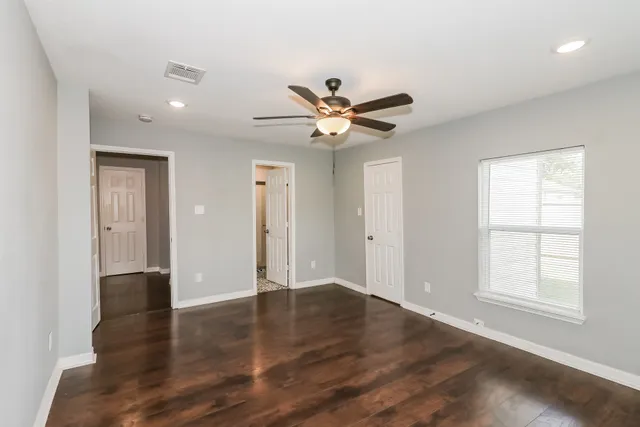 a view of an empty room with a window