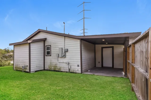 a view of a backyard with cabin