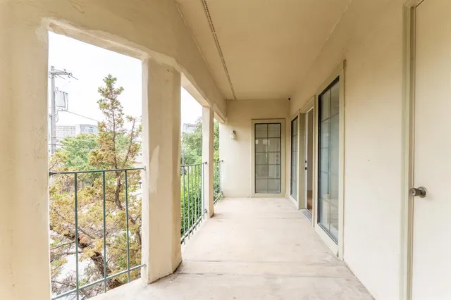 a view of a hallway with windows
