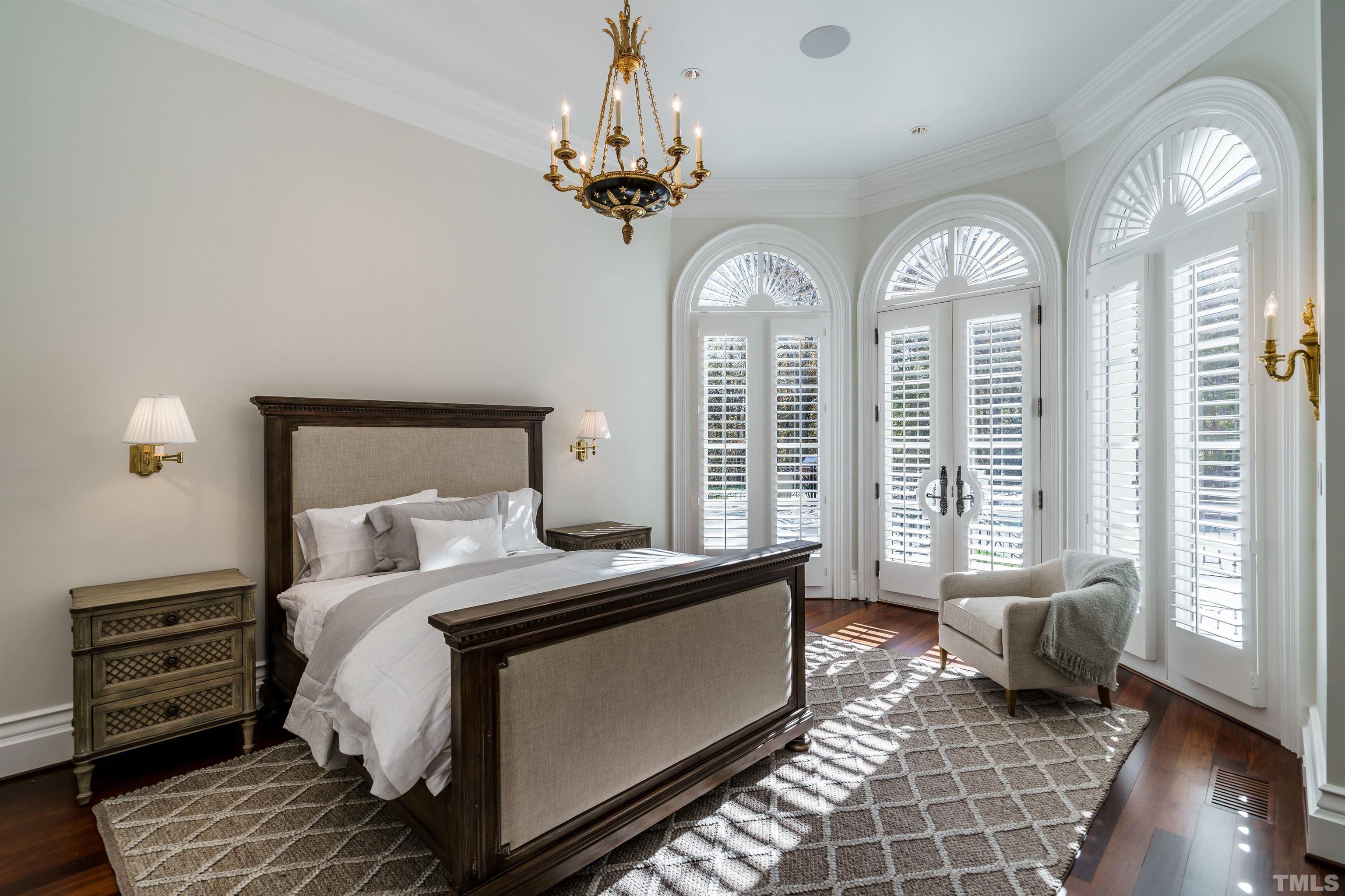 1624 Morning Mountain Road Raleigh, NC 27614 - Photo 17 of 30 a bedroom with a large bed and wooden floor
