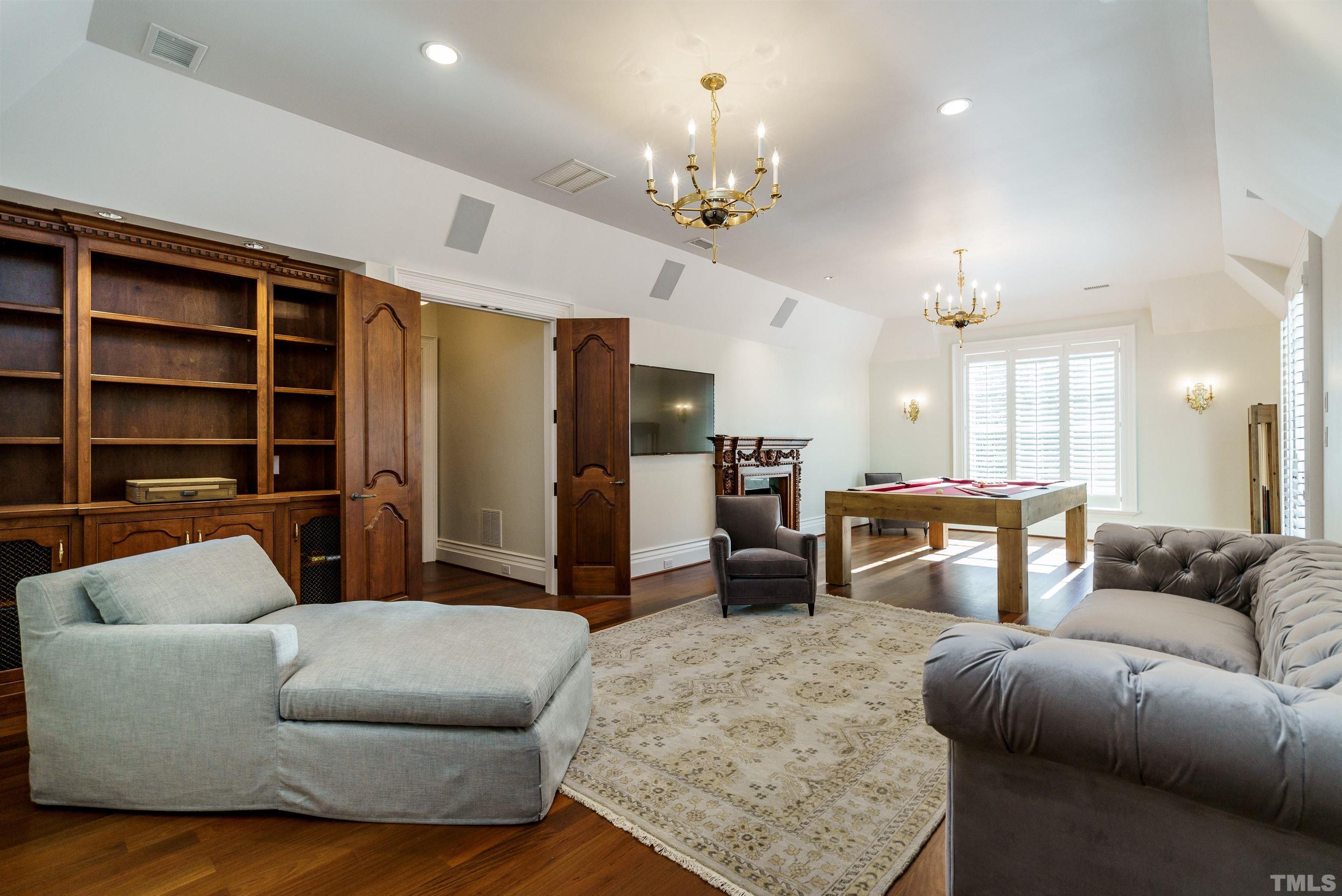 1624 Morning Mountain Road Raleigh, NC 27614 - Photo 25 of 30 a living room with furniture and a chandelier