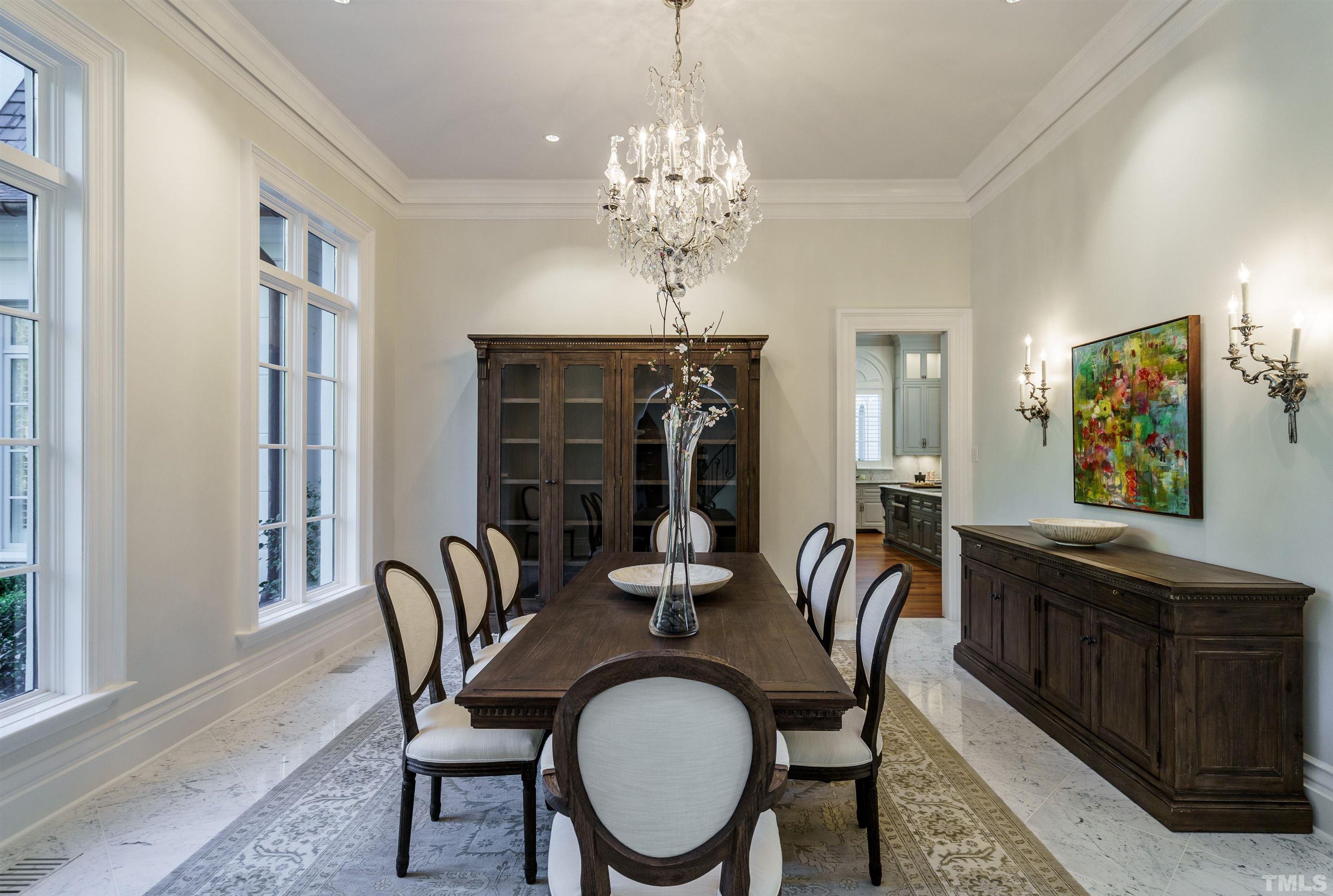 1624 Morning Mountain Road Raleigh, NC 27614 - Photo 5 of 30 a dining room with furniture a chandelier and window
