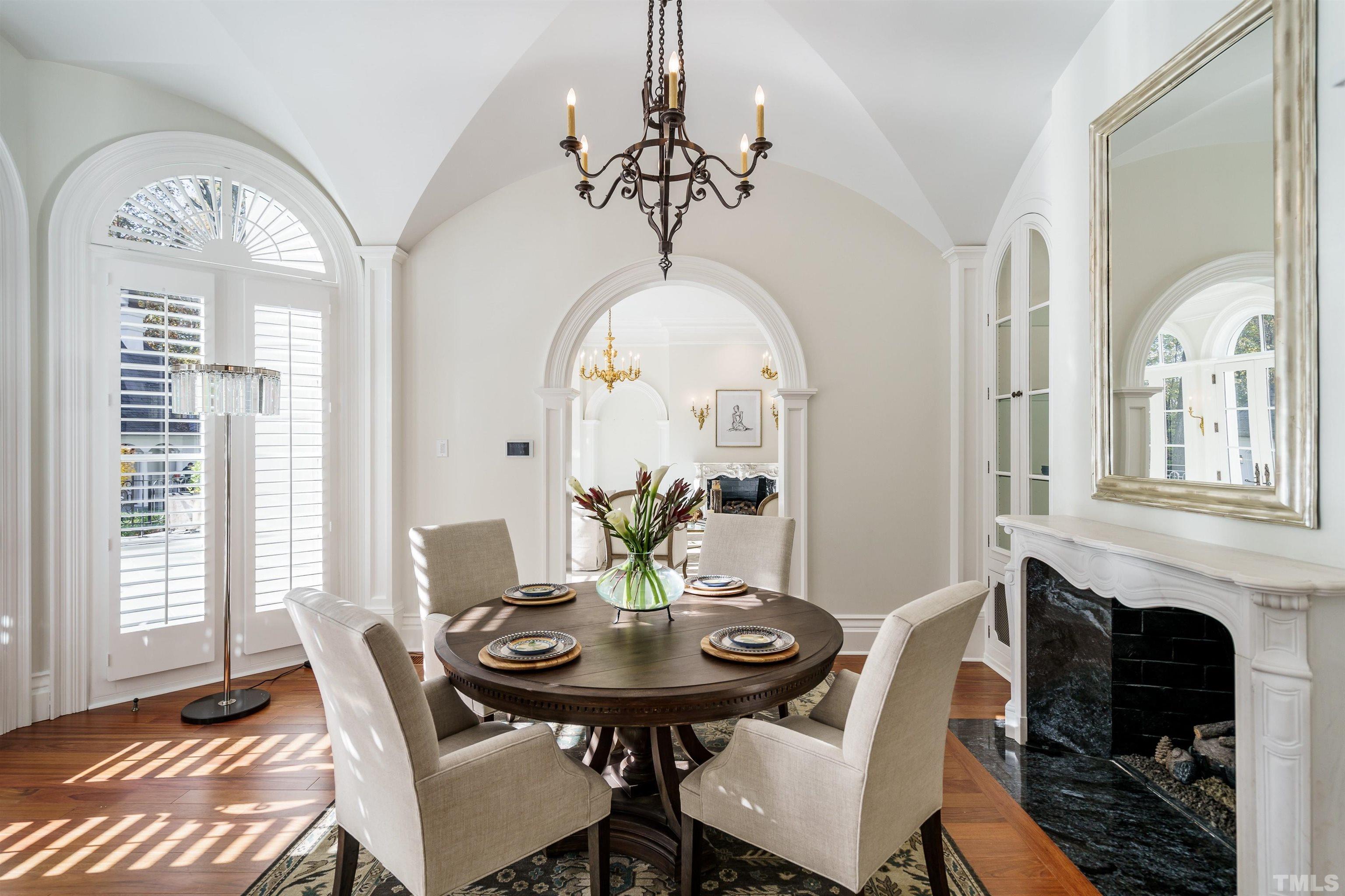 1624 Morning Mountain Road Raleigh, NC 27614 - Photo 7 of 30 a view of a dining room with furniture window and wooden floor