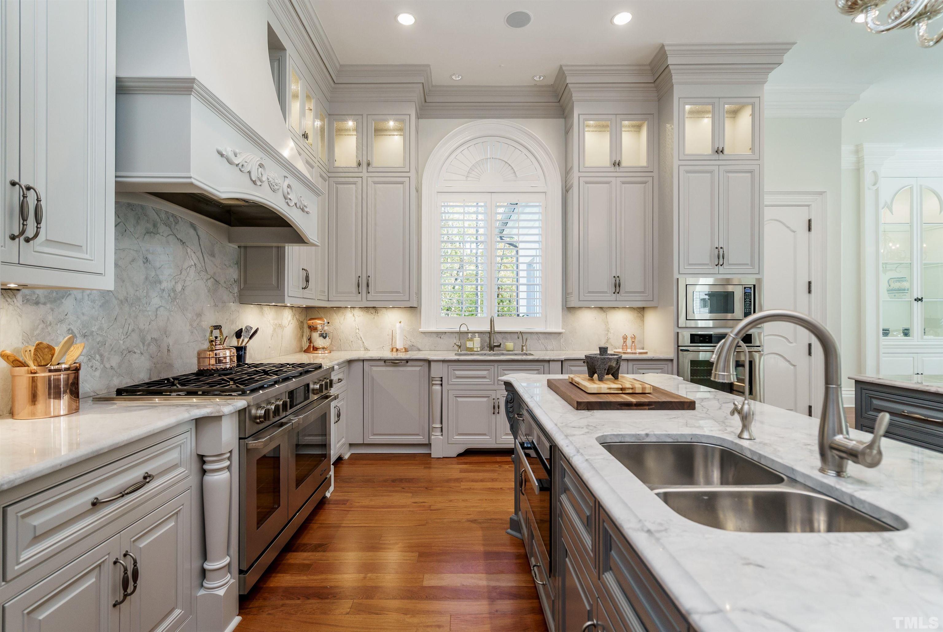 1624 Morning Mountain Road Raleigh, NC 27614 - Photo 10 of 30 a kitchen with stainless steel appliances granite countertop a sink stove and cabinets