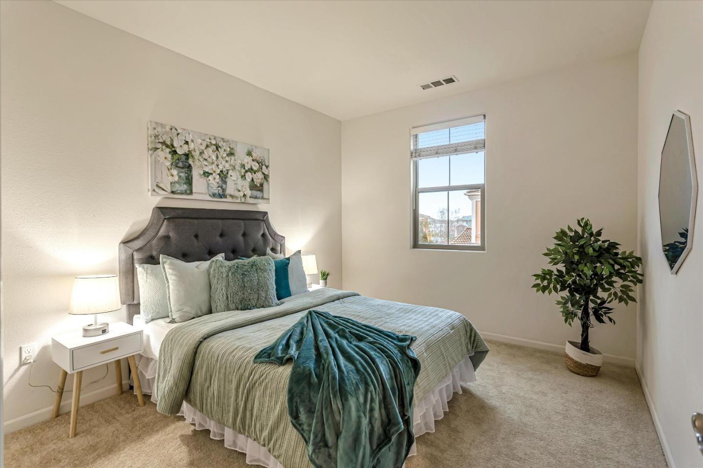 1886 Trento Loop Milpitas, CA 95035 - Photo 11 of 43 a bedroom with a bed and a potted plant