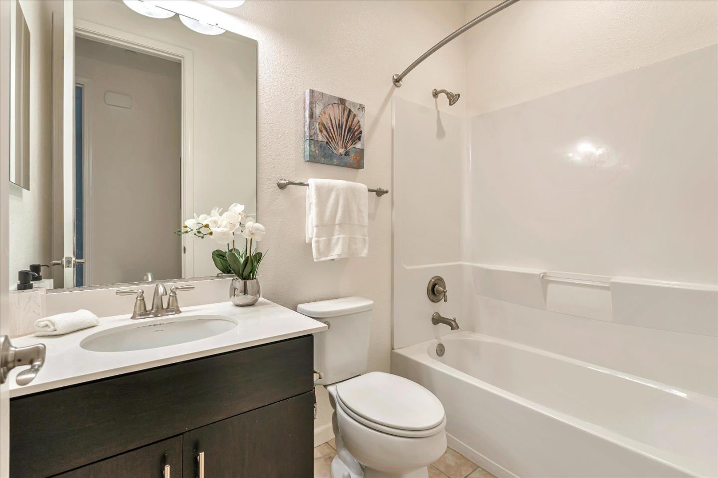 1886 Trento Loop Milpitas, CA 95035 - Photo 15 of 43 a bathroom with a sink a toilet and shower