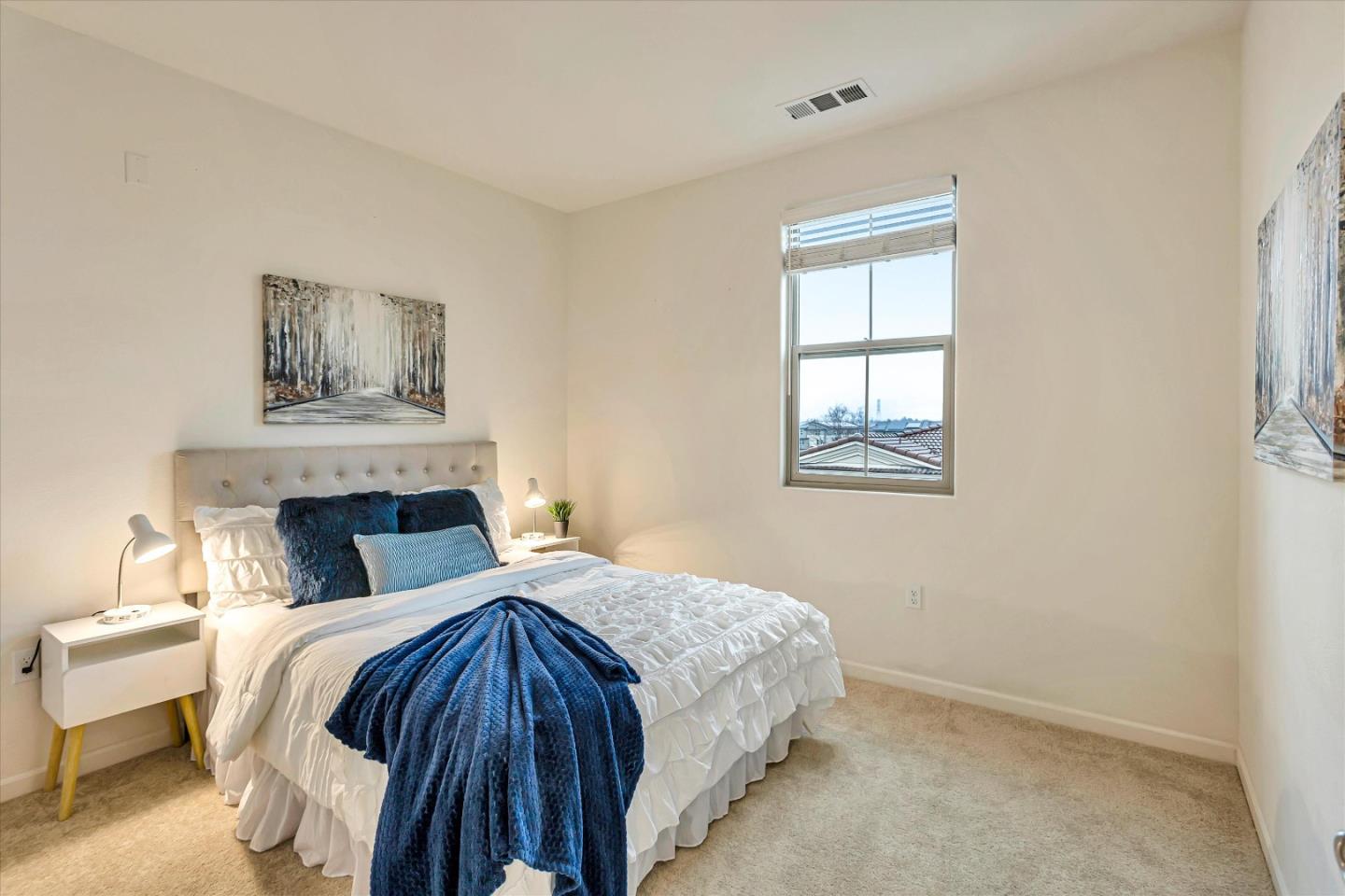 1886 Trento Loop Milpitas, CA 95035 - Photo 16 of 43 a bedroom with a bed and a window